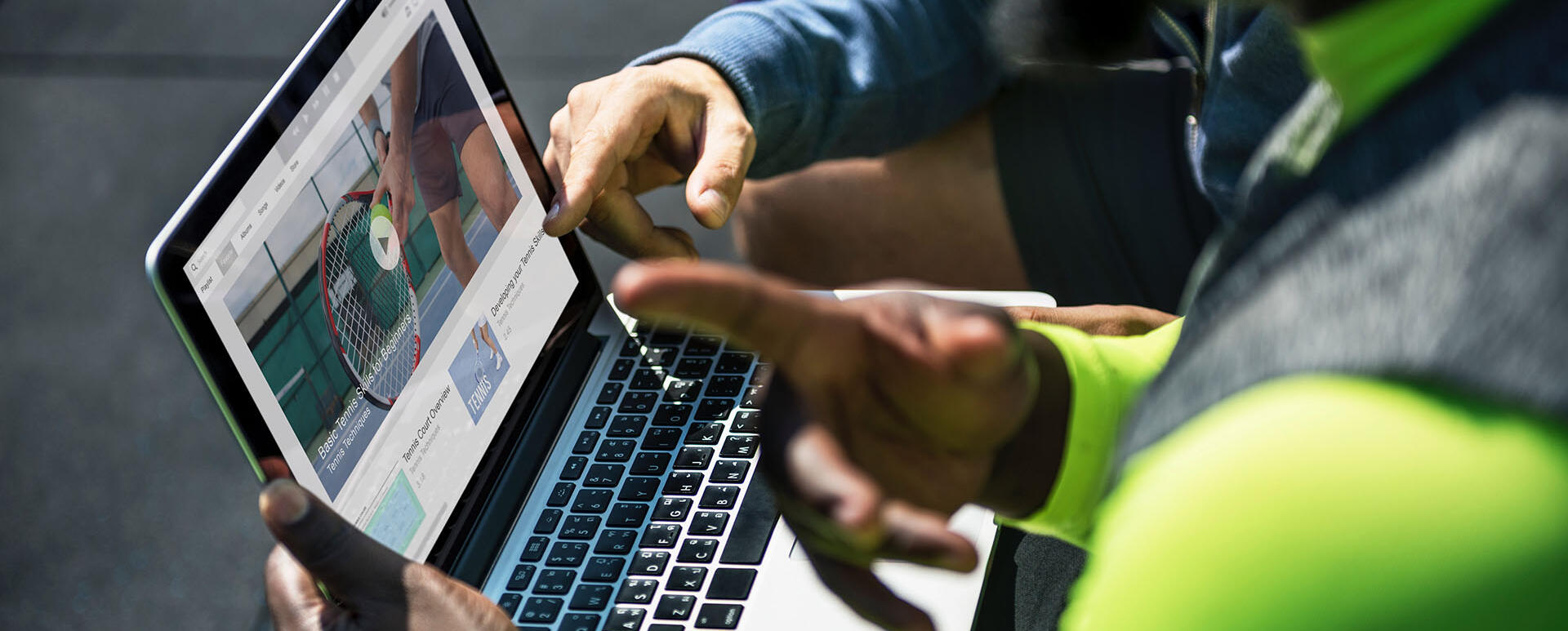 Two men discussing the design of the website